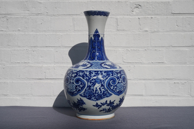 A Chinese blue and white bottle vase with dancers on a floral ground, 19th C.