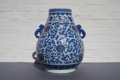 A Chinese blue, white and copper red 'hu' vase, Qianlong mark, 19/20th C.