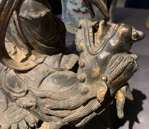 A large Chinese bronze group of Guanyin on a dragon, prob. Ming