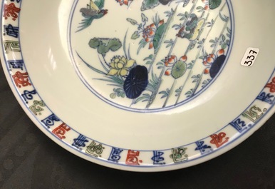 A pair of Chinese doucai 'ducks and lotus pond' plates, Chenghua mark, 18th C.