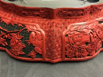 A Chinese cinnabar lacquer box and cover with figures in a landscape, 19th C.