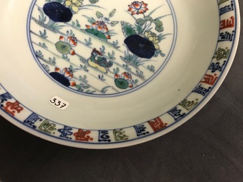 A pair of Chinese doucai 'ducks and lotus pond' plates, Chenghua mark, 18th C.