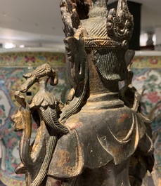 A large Chinese bronze group of Guanyin on a dragon, prob. Ming