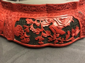 A Chinese cinnabar lacquer box and cover with figures in a landscape, 19th C.