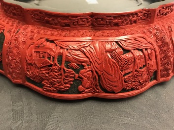 A Chinese cinnabar lacquer box and cover with figures in a landscape, 19th C.