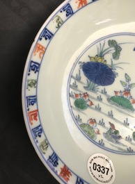 A pair of Chinese doucai 'ducks and lotus pond' plates, Chenghua mark, 18th C.