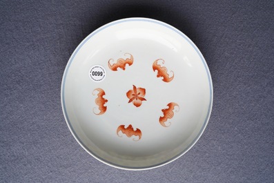A Chinese iron red and blue and white 'bats and peaches' plate, 19th C.