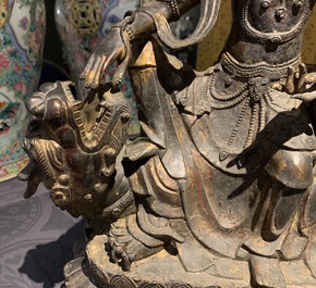 A large Chinese bronze group of Guanyin on a dragon, prob. Ming