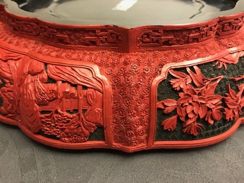 A Chinese cinnabar lacquer box and cover with figures in a landscape, 19th C.