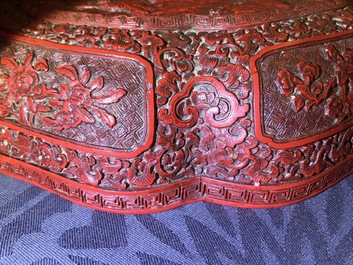 A Chinese cinnabar lacquer box and cover with figures in a landscape, 19th C.