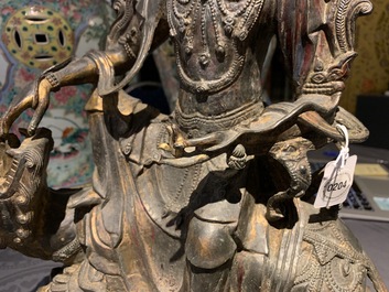 A large Chinese bronze group of Guanyin on a dragon, prob. Ming