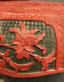 A Chinese cinnabar lacquer box and cover with figures in a landscape, 19th C.