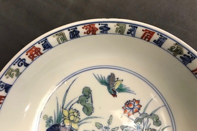 A pair of Chinese doucai 'ducks and lotus pond' plates, Chenghua mark, 18th C.