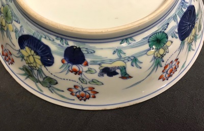 A pair of Chinese doucai 'ducks and lotus pond' plates, Chenghua mark, 18th C.