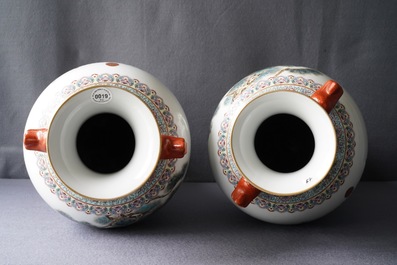 A pair of Chinese famille rose 'peacock' vases, Qianlong mark, Republic, 20th C.