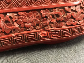 A Chinese cinnabar lacquer box and cover with figures in a landscape, 19th C.