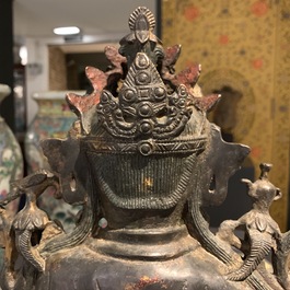 A large Chinese bronze group of Guanyin on a dragon, prob. Ming