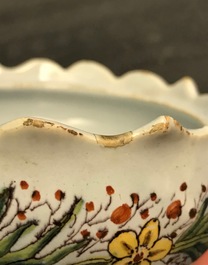 A pair of polychrome Dutch Delft butter tubs with ladies selling flowers and fruits, 18th C.