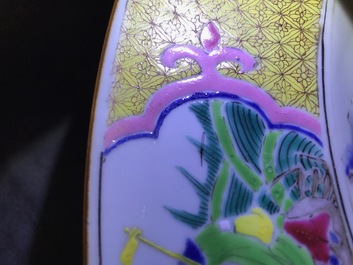 Un grand plat en porcelaine de Chine famille rose &agrave; d&eacute;cor de figures aupr&egrave;s d'un temple, Yongzheng