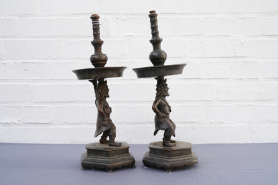A pair of Chinese bronze candlesticks, Ming