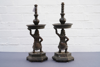 A pair of Chinese bronze candlesticks, Ming