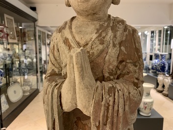 A Chinese painted wood figure of a Buddhist monk, 19th C.