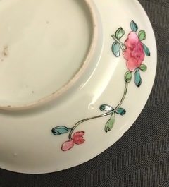 A pair of Chinese famille rose cups and saucers, Yongzheng