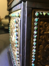 A turquoise-inlaid gilt bronze and copper repouss&eacute; 'tepchog' folding altar table, Tibet, 19th C.