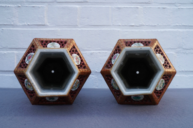 A pair of Chinese reticulated double-walled hexagonal famille rose vases, Yongzheng