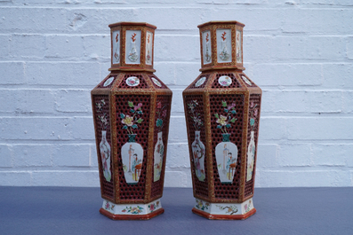 A pair of Chinese reticulated double-walled hexagonal famille rose vases, Yongzheng