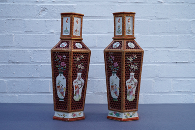 Une paire de vases &agrave; double parois en porcelaine de Chine famille rose, Yongzheng