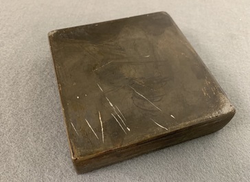 A square Chinese inscribed wood-encased duan inkstone, 19/20th C.