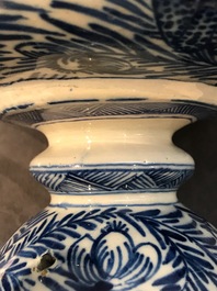 A pair of large Dutch Delft blue and white vases and covers, 18th C.