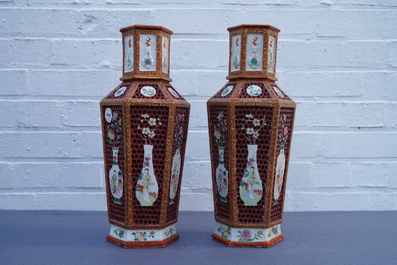 A pair of Chinese reticulated double-walled hexagonal famille rose vases, Yongzheng