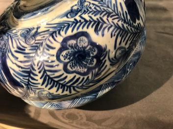 A pair of large Dutch Delft blue and white vases and covers, 18th C.