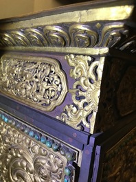 A turquoise-inlaid gilt bronze and copper repouss&eacute; 'tepchog' folding altar table, Tibet, 19th C.