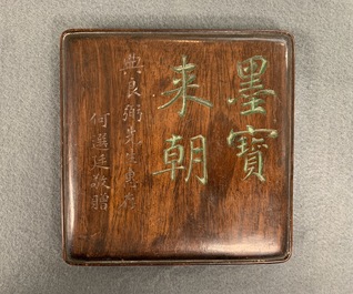 A square Chinese inscribed wood-encased duan inkstone, 19/20th C.