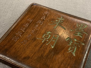 A square Chinese inscribed wood-encased duan inkstone, 19/20th C.