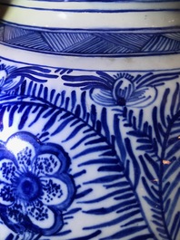 A pair of large Dutch Delft blue and white vases and covers, 18th C.