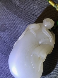 A Chinese white jade pendant of a monkey on a pouch, Qing