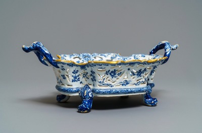 A reticulated Dutch Delft blue and white basket with a view on a wine cellar, 18th C.