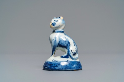 A Dutch Delft blue and white miniature model of a cat, 18th C.
