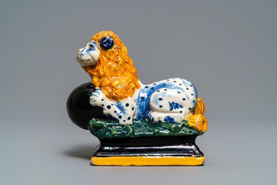 A black-enhanced polychrome Dutch Delft model of a lion, 1st half 18th C.