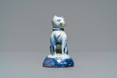 A Dutch Delft blue and white miniature model of a cat, 18th C.