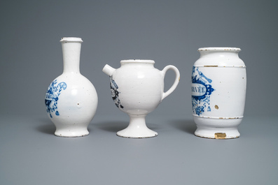 A large Dutch Delft blue and white albarello, a wet drug jar and a Brussels faience bottle, 18th C.