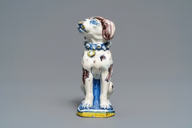 A polychrome Dutch Delft model of a dog, early 18th C.