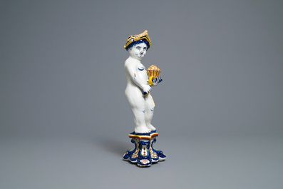 A polychrome Dutch Delft model of a boy, allegory of spring, 18th C.