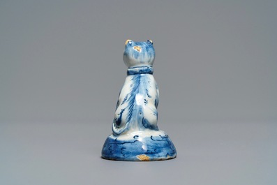 A Dutch Delft blue and white miniature model of a cat, 18th C.