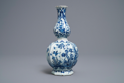A ribbed Dutch Delft blue and white double gourd vase, early 18th C.
