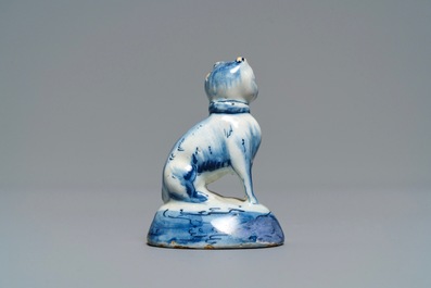 A Dutch Delft blue and white miniature model of a cat, 18th C.